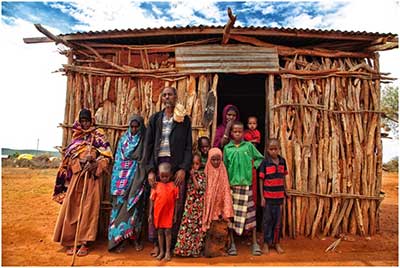 Yusuf Abdi Farrah poses for a photo with members of his large family